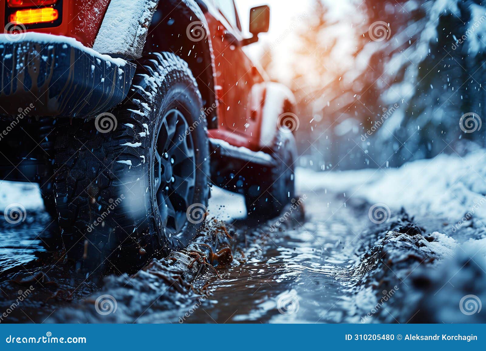 wheel with tire of driving suv on dirt off road adventure to nature in forest in winter