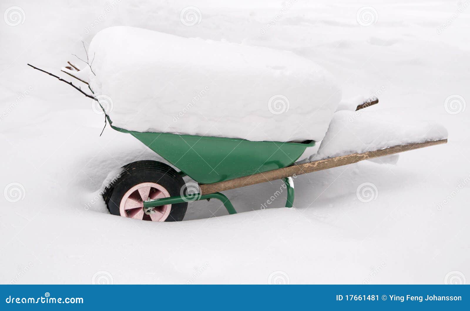 wheelbarrow covered in snow