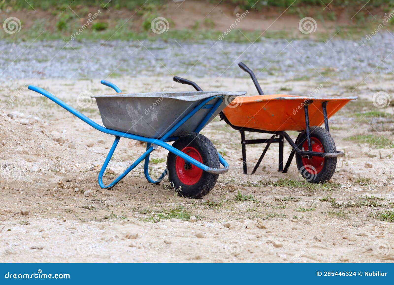 Wheelbarrows for Construction Work on the Sand Stock Photo Image of