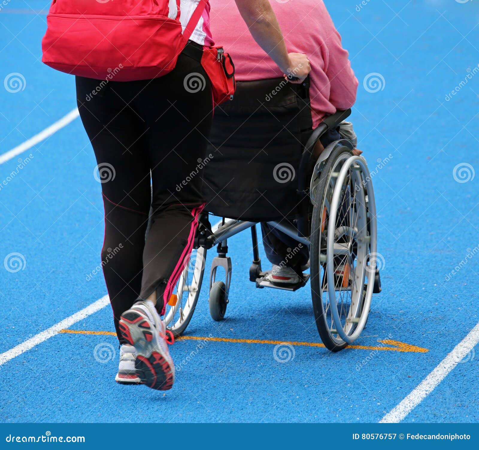 Wheelchair with an Attendant on the Athletic Track during the Sp Stock Image Image of people