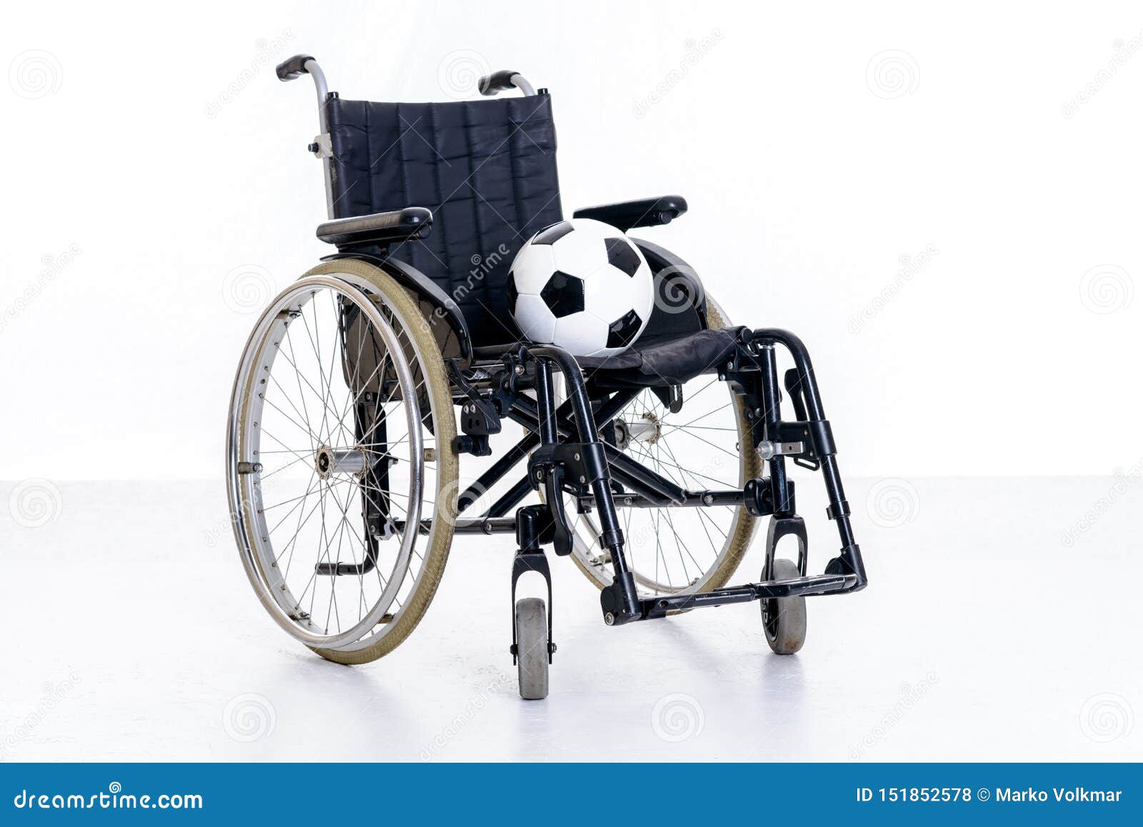 Wheelchair with ball stock photo. Image of medical, football 151852578
