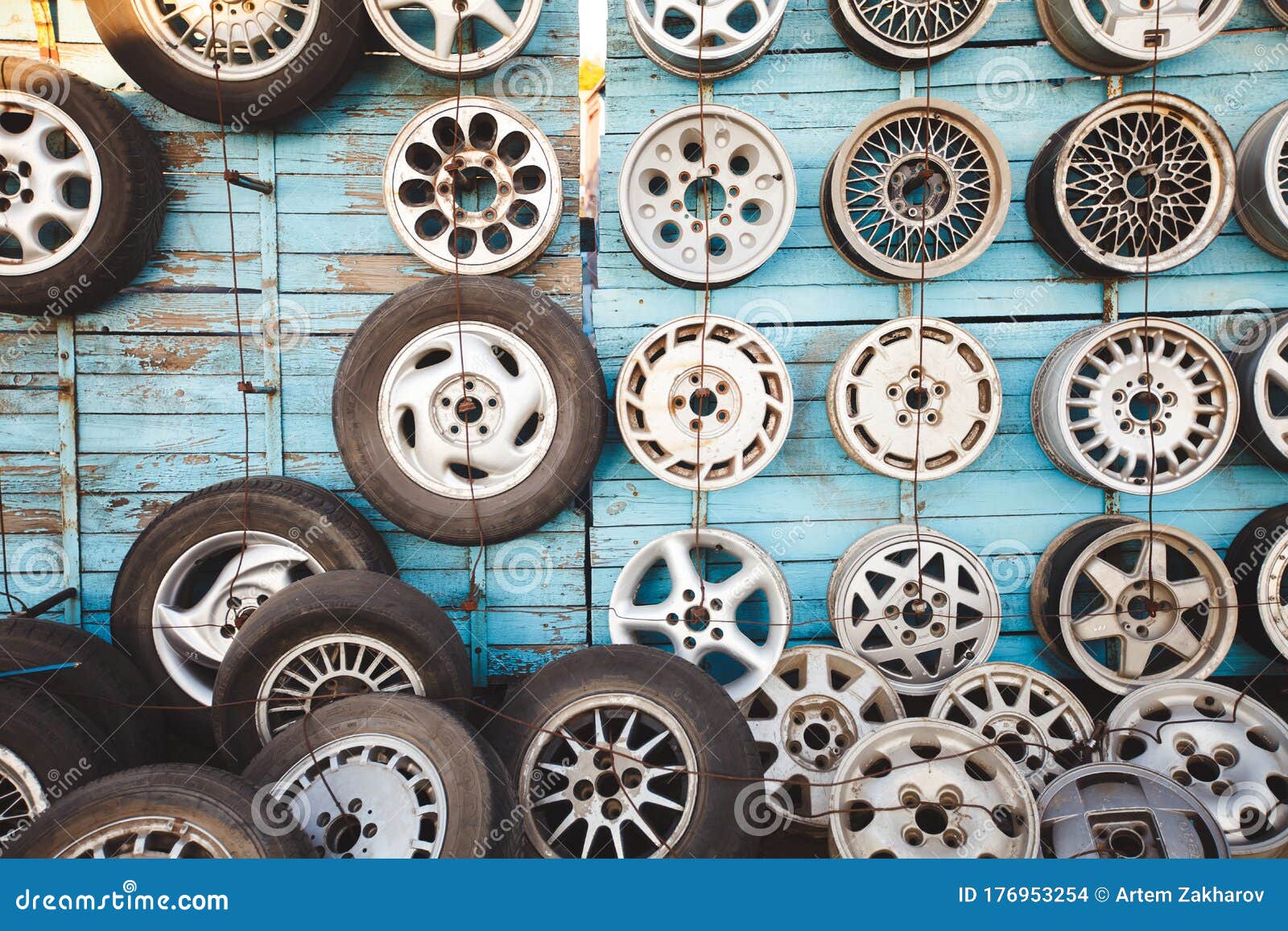 Wheels and Tires on the Wall in the Car Dealership. Stock Photo Image