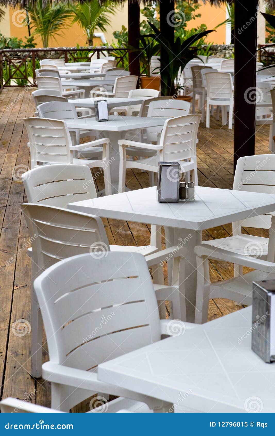 Whie Plastic Chairs and Tables on the Patio Stock Image Image of