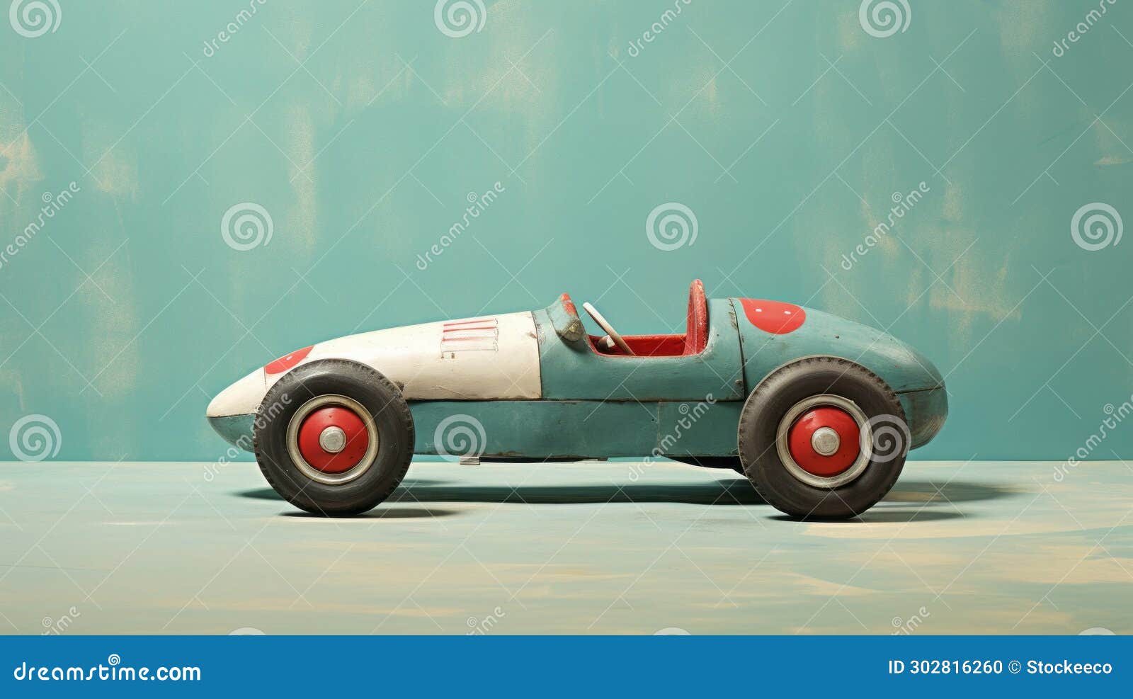 vintage-inspired toy race car with metallic finishes on blue floor