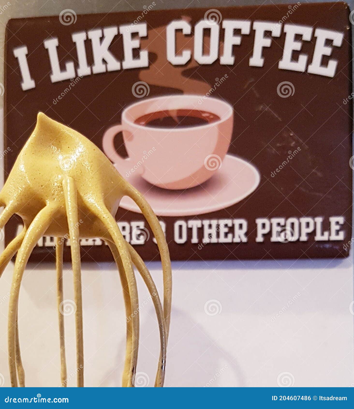 Whipped coffee on a whisk stock photo. Image of cream 204607486