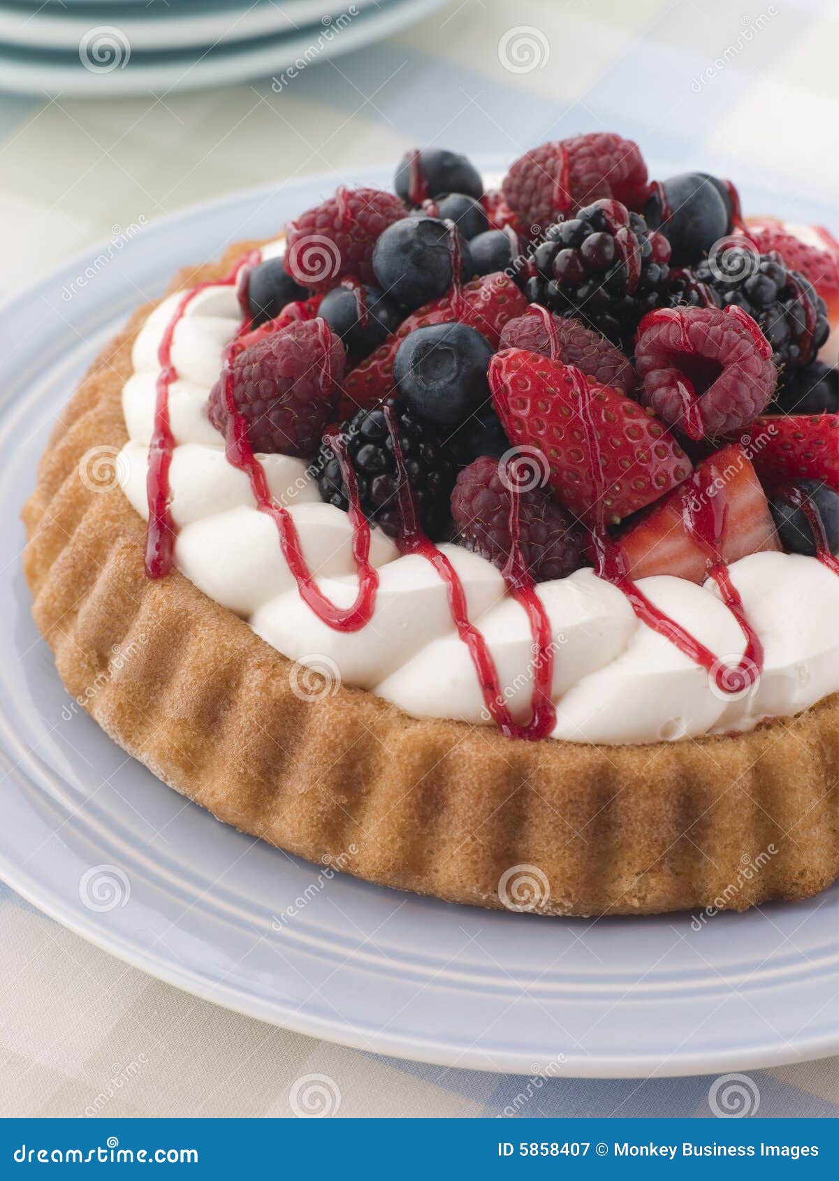 whipped cream and berry sponge flan