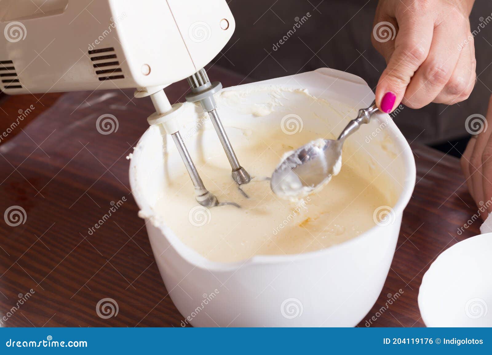 Whipping the Cream with an Electric Mixer Stock Photo Image of class