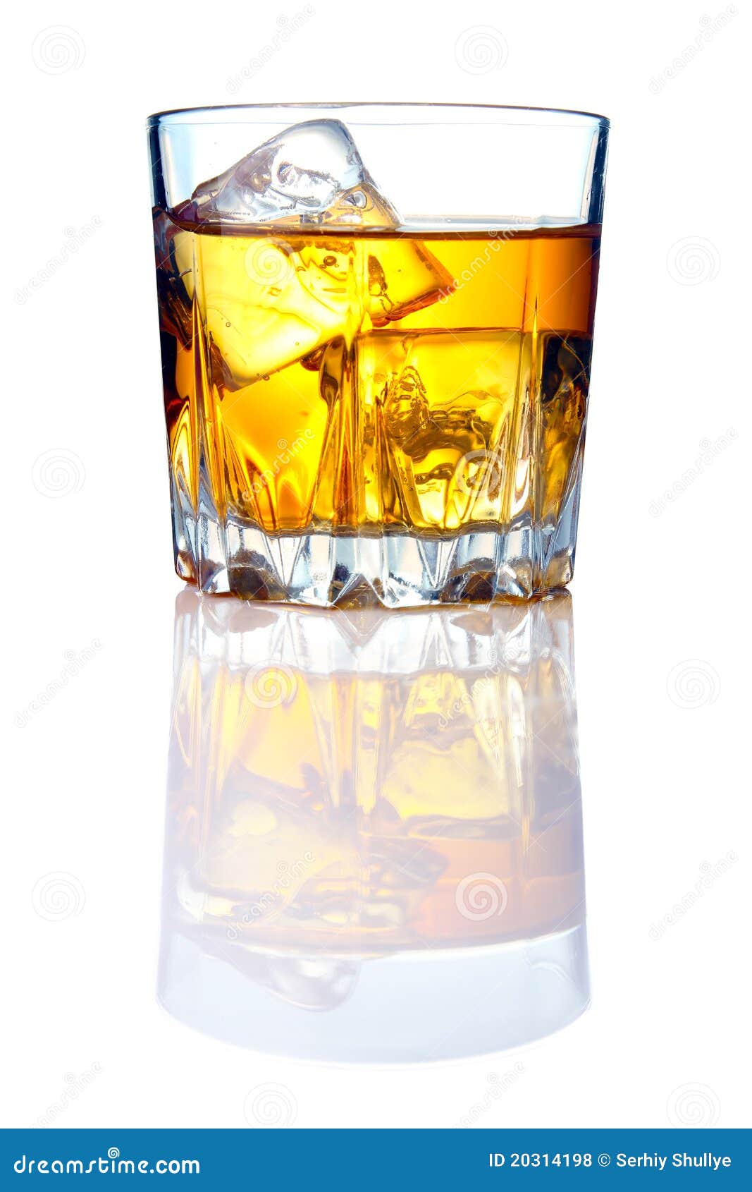 whiskey glass with ice cubes and reflections