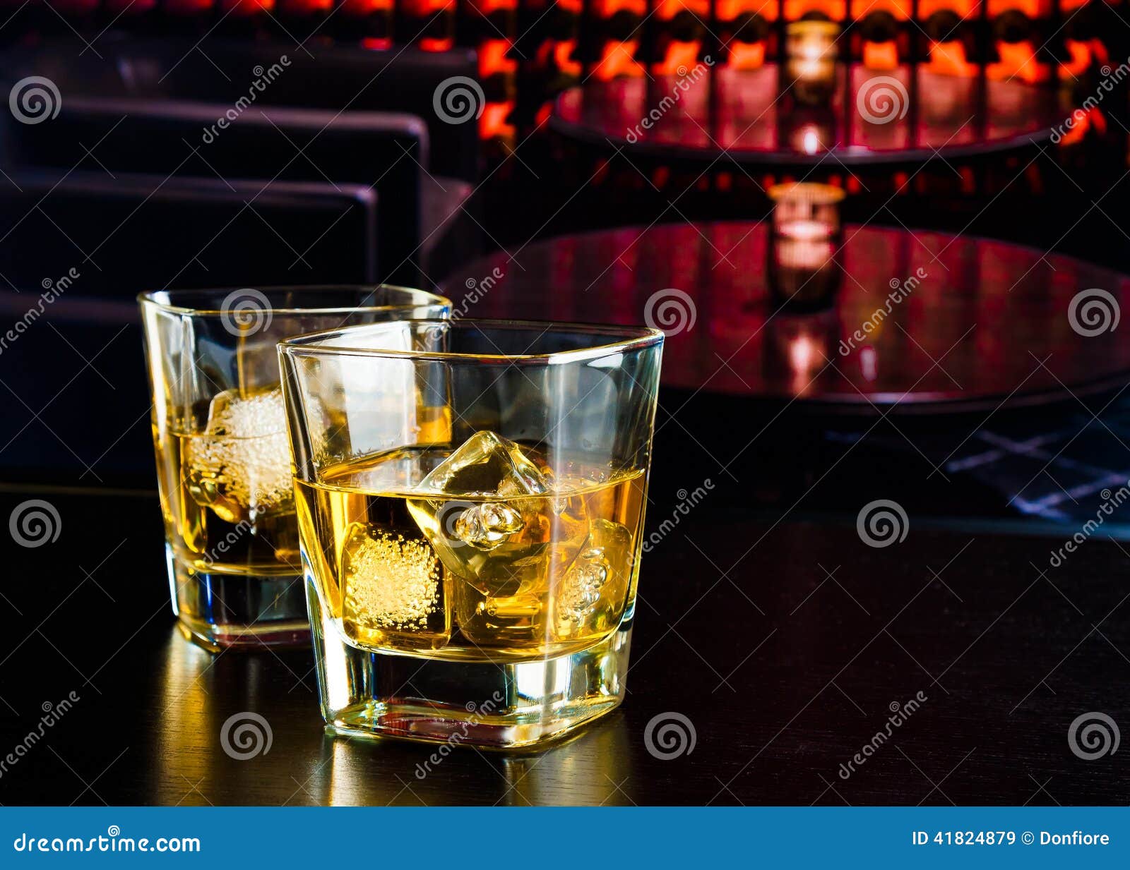 whiskey glasses with ice in a lounge bar