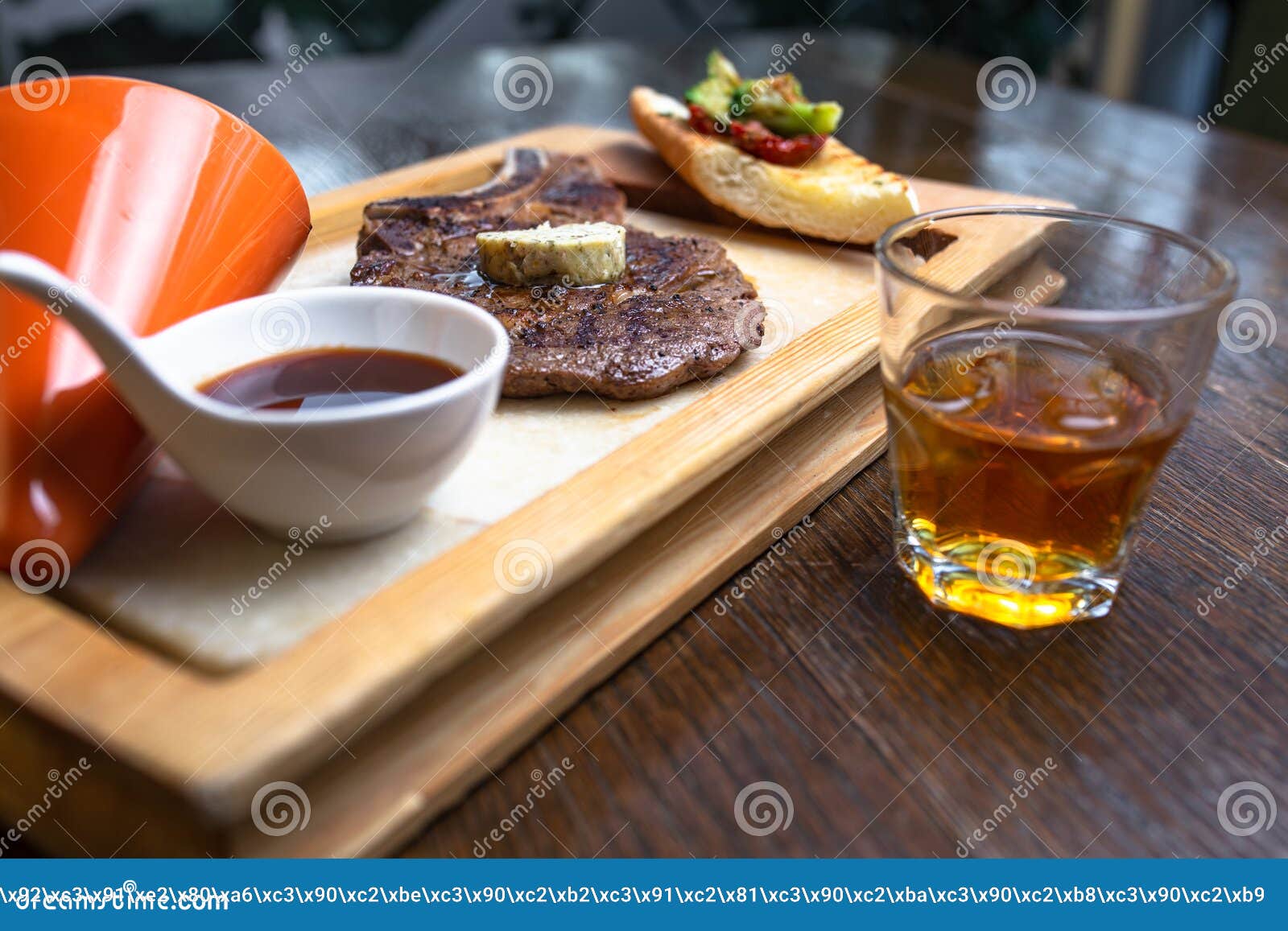 Whiskey and Steak with Sauce on Wood. Stock Photo Image of cooked