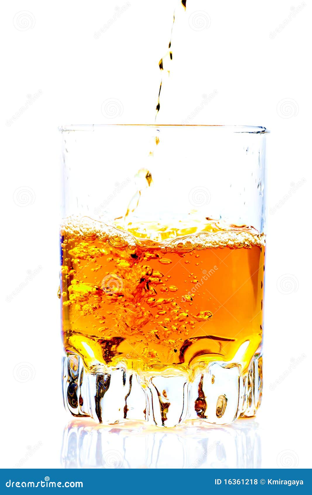 whisky,rum or any other golden liquor being poured