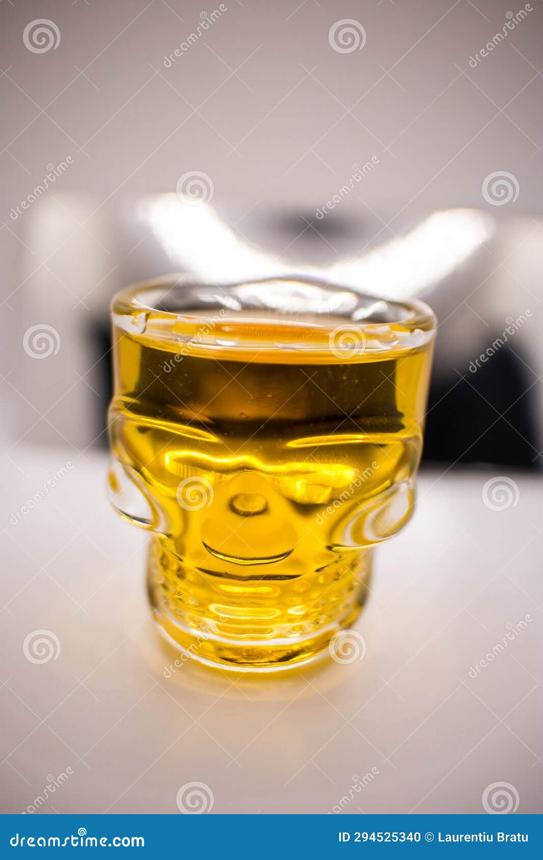 whisky, rum shat in a glass with a canius pattern