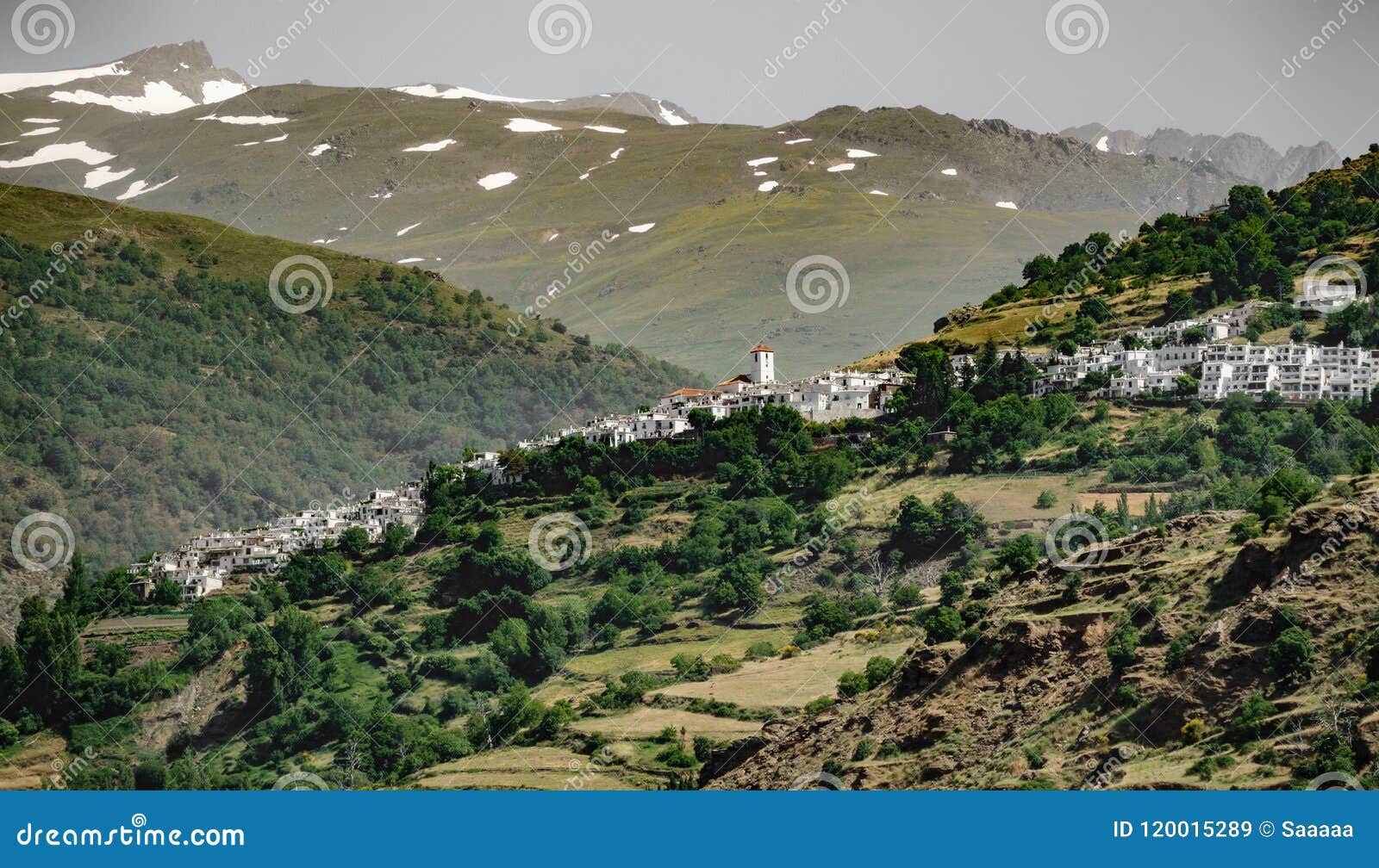 white andalusian village of capileira with veleta peak