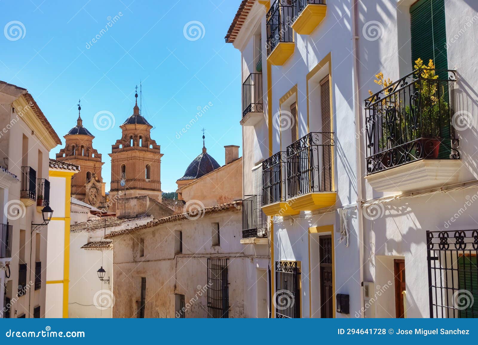 white andalusian village of velez rubio with its white houses and tall church towers, andalusia.