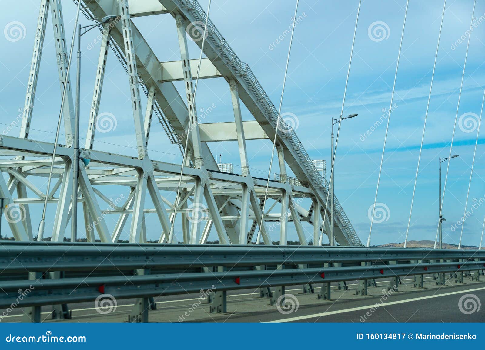 white arches of new crimean bridge, also called kerch bridge, through kerch strait to crimea. automobile and railway bridge