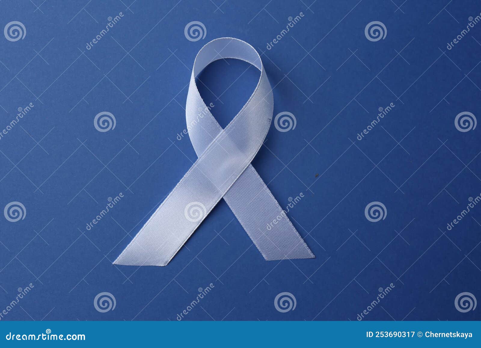 White Awareness Ribbon on Blue Background, Top View Stock Image Image