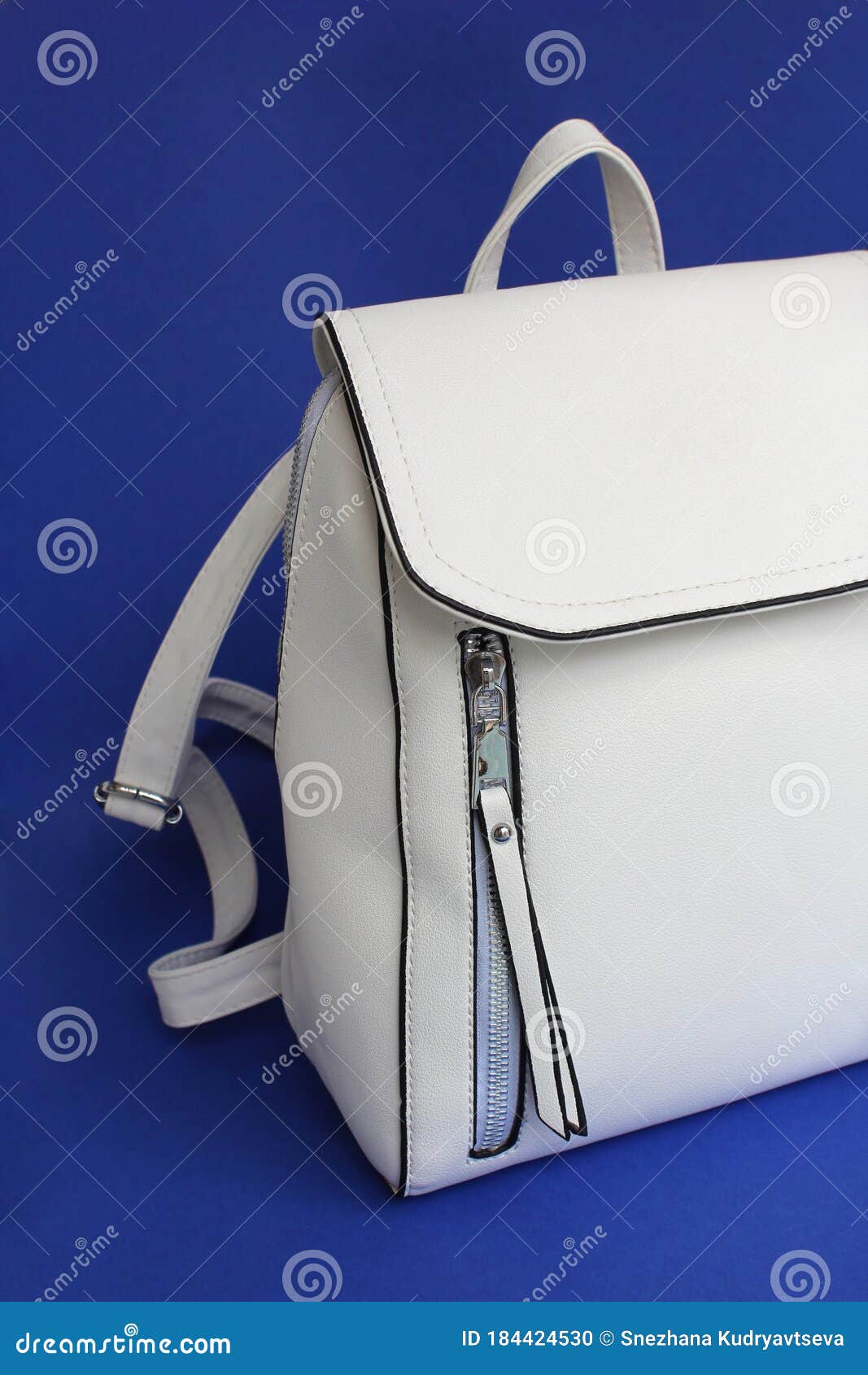 white bag backpack on a blue background