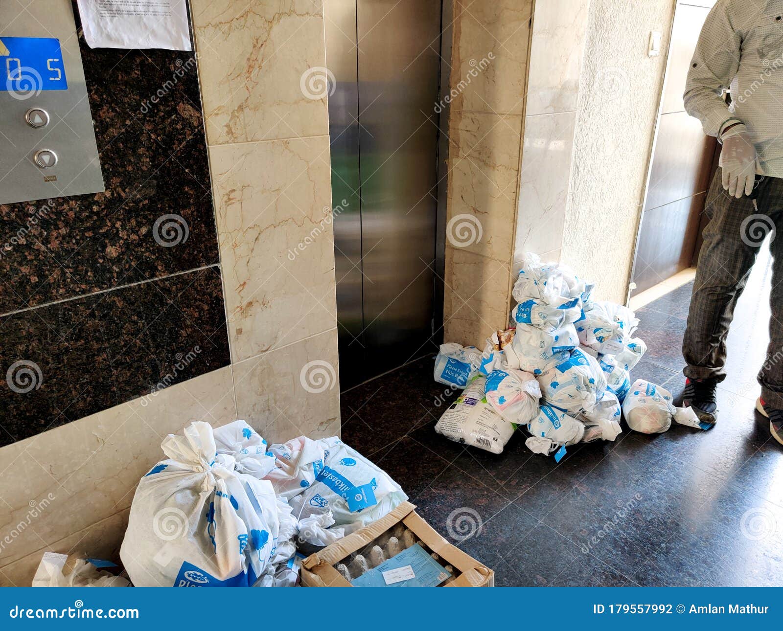 Indian Woman Girl Holding Up A Milkbasked Bag With Daily Subscription Home  Delivery With Face Hidden Stock Photo, Picture and Royalty Free Image.  Image 143855767.