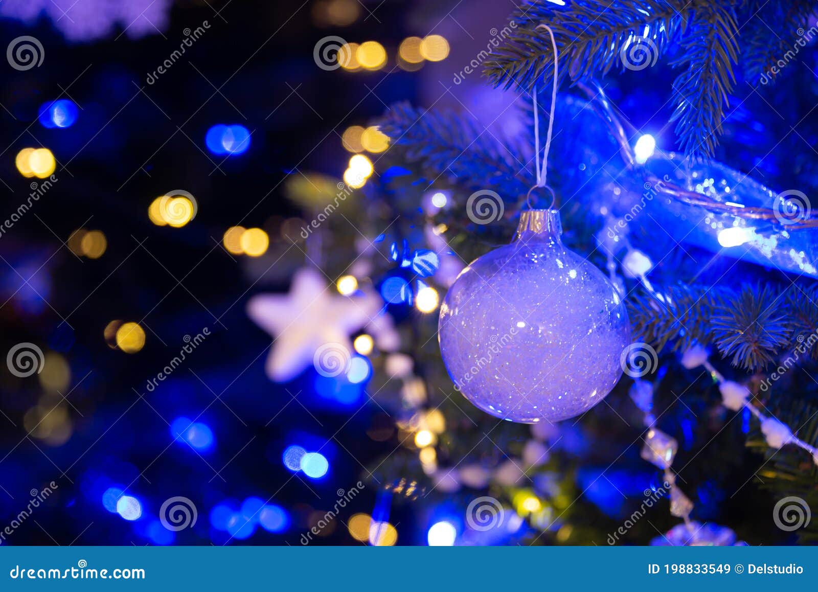 White Ball Hanging on a Christmas Tree, Christmas Ornaments at Night ...