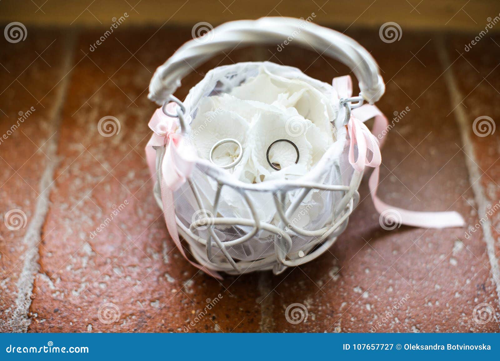 White Basket with Wedding Rings on the Table Stock Image Image of