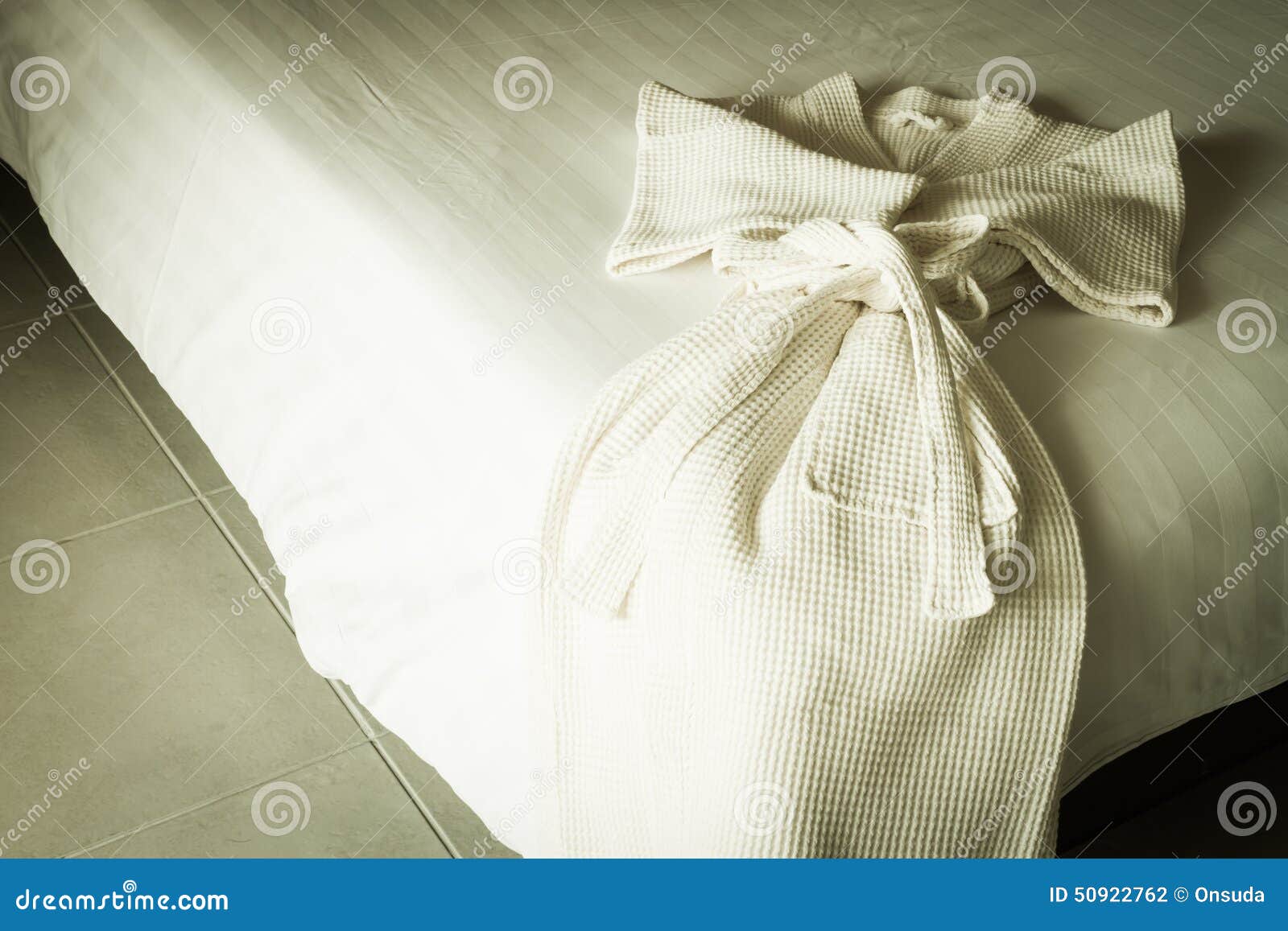 White bathrobe on bed stock photo. Image of bathrobe 50922762
