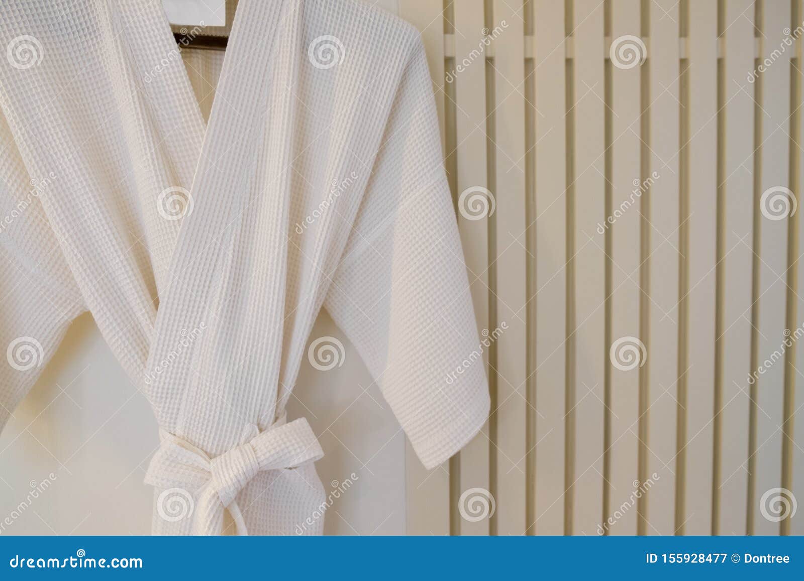 White Bathrobe on a Hanger on the Wall Stock Image Image of indoors