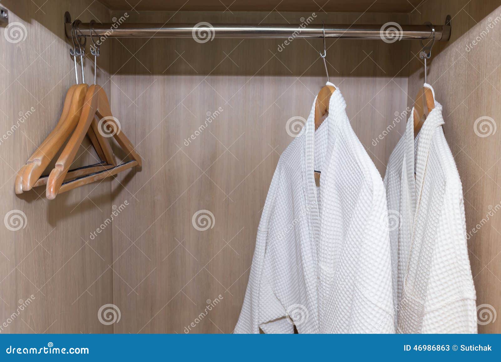 White bathrobes hanging stock image. Image of bathroom 46986863