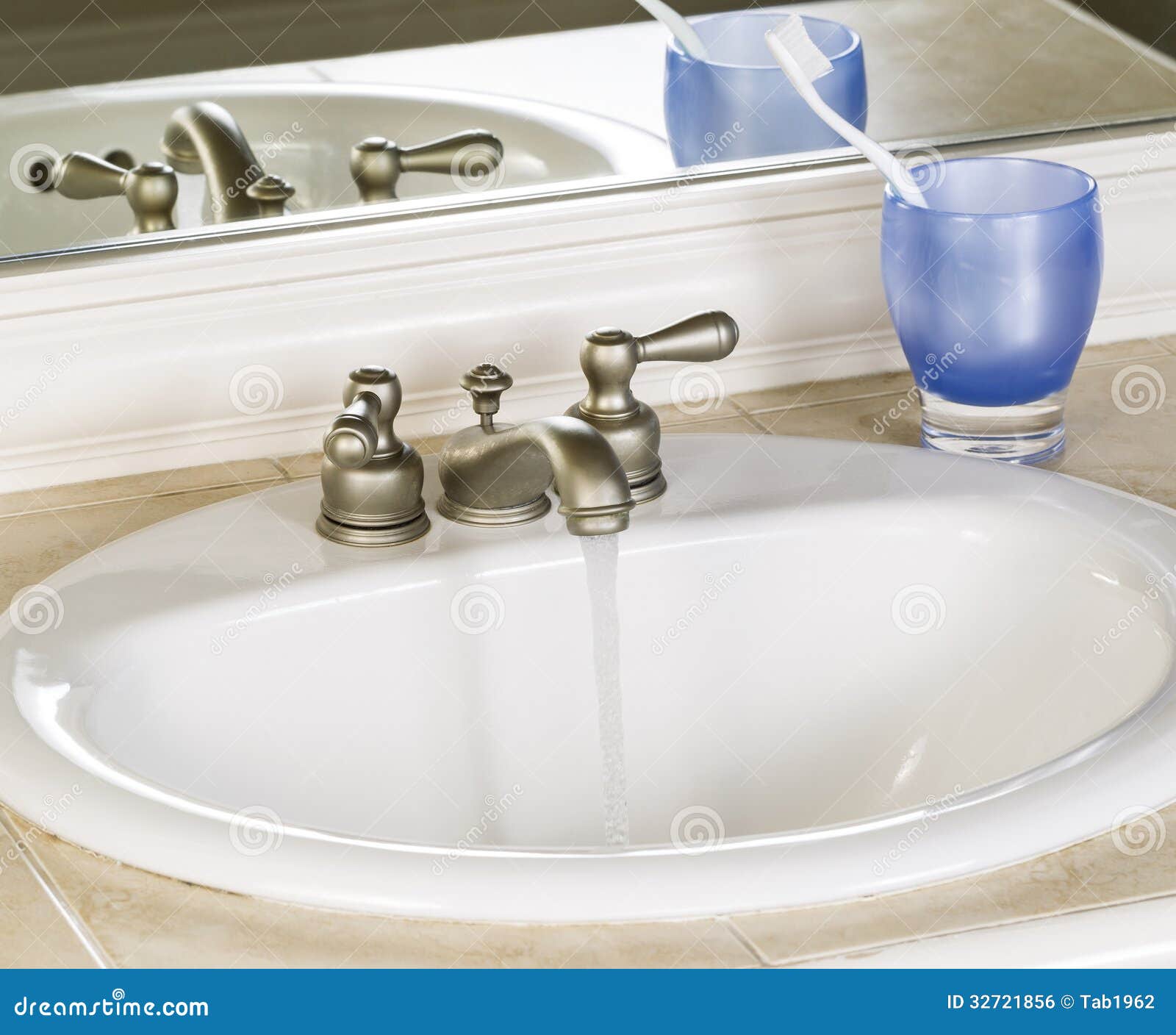 White Bathroom Sink And Faucet In Open Position With Clean Water