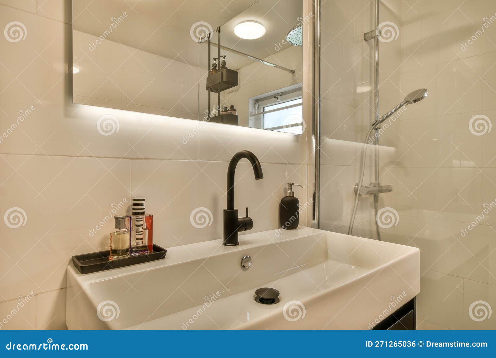 A White Bathroom with a Sink and a Shower Stock Photo Image of room