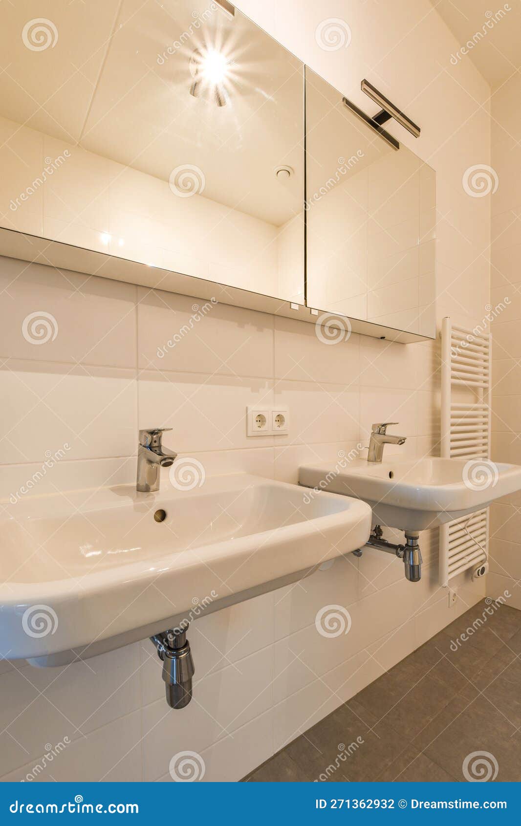 A White Bathroom with Two Sinks and a Mirror Stock Photo Image of
