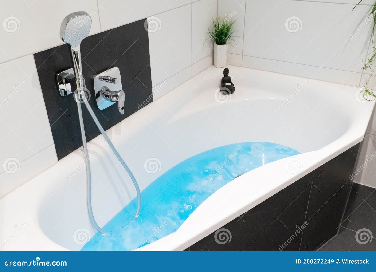 White Bathtub with the Light Blue Bathwater Stock Image Image of
