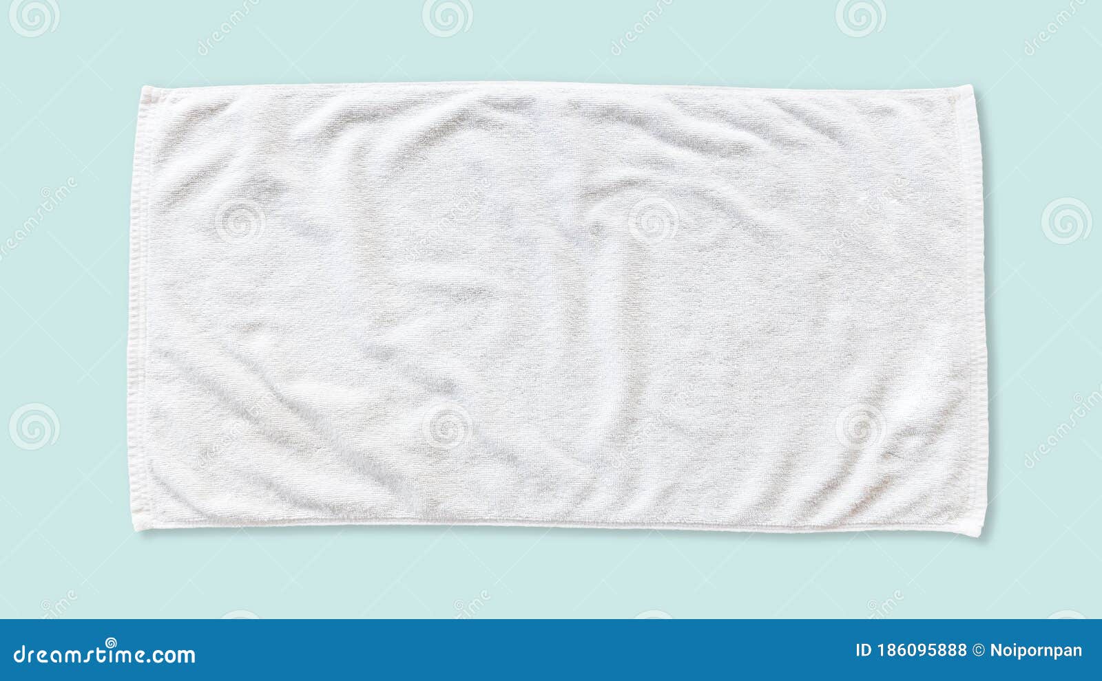 white beach towel mock up  with clipping path on blue background, flat lay top view