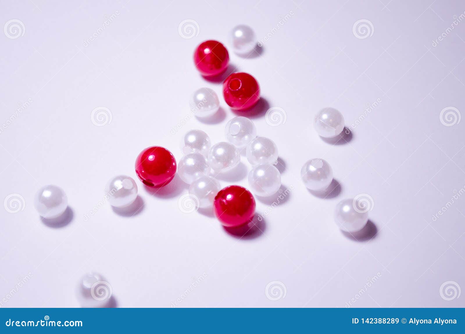 white beads. cherry beads. placer beads. beads are bigger and smaller. imitation pearls. plastic beads. placer beads.