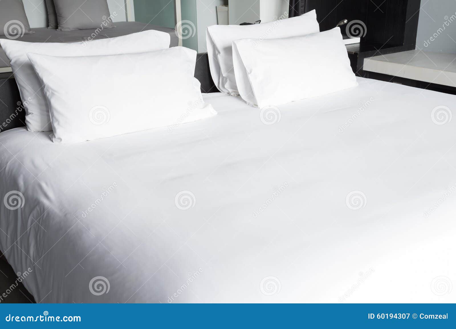 white bed sheets and pillows