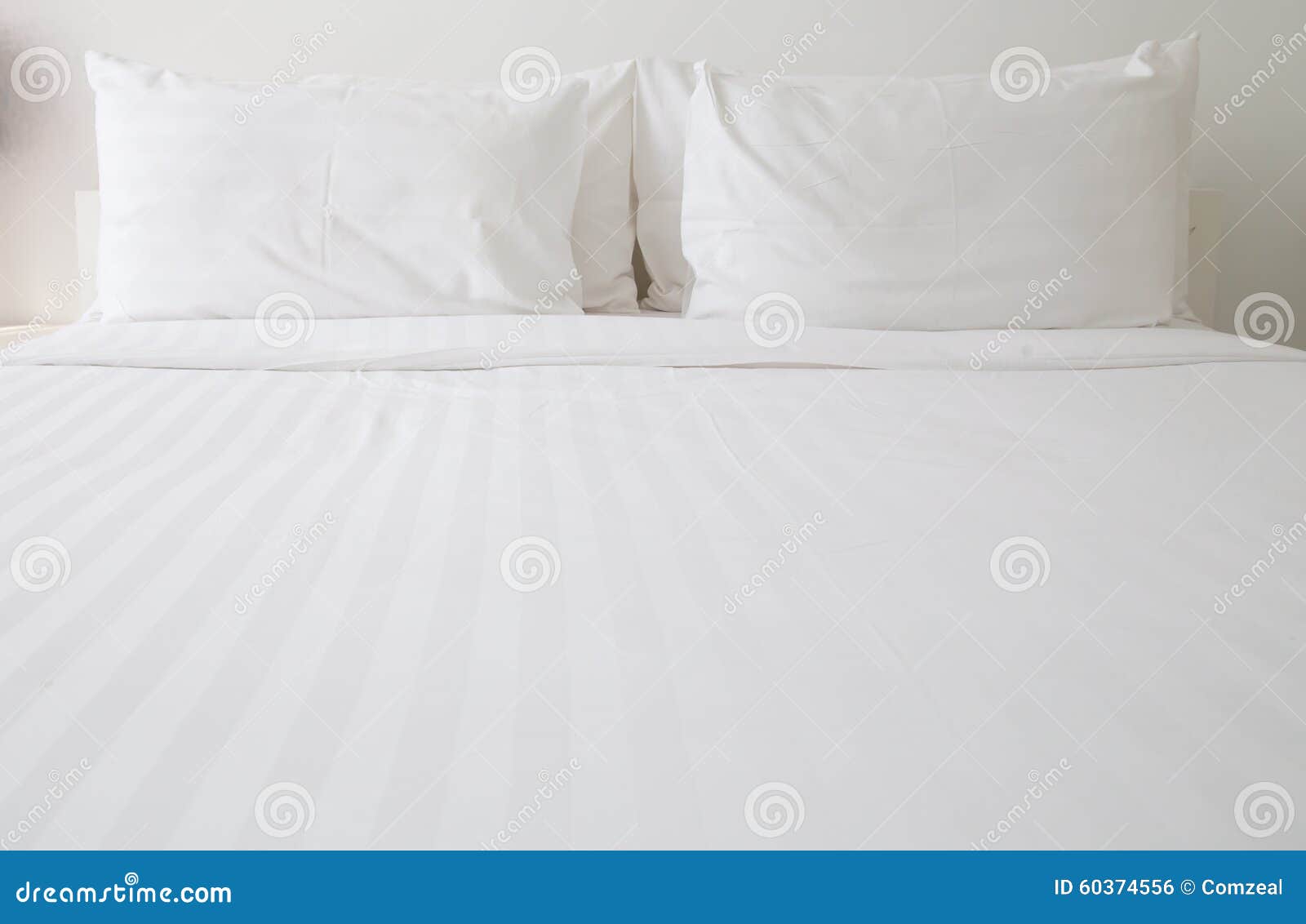 white bed sheets and pillows