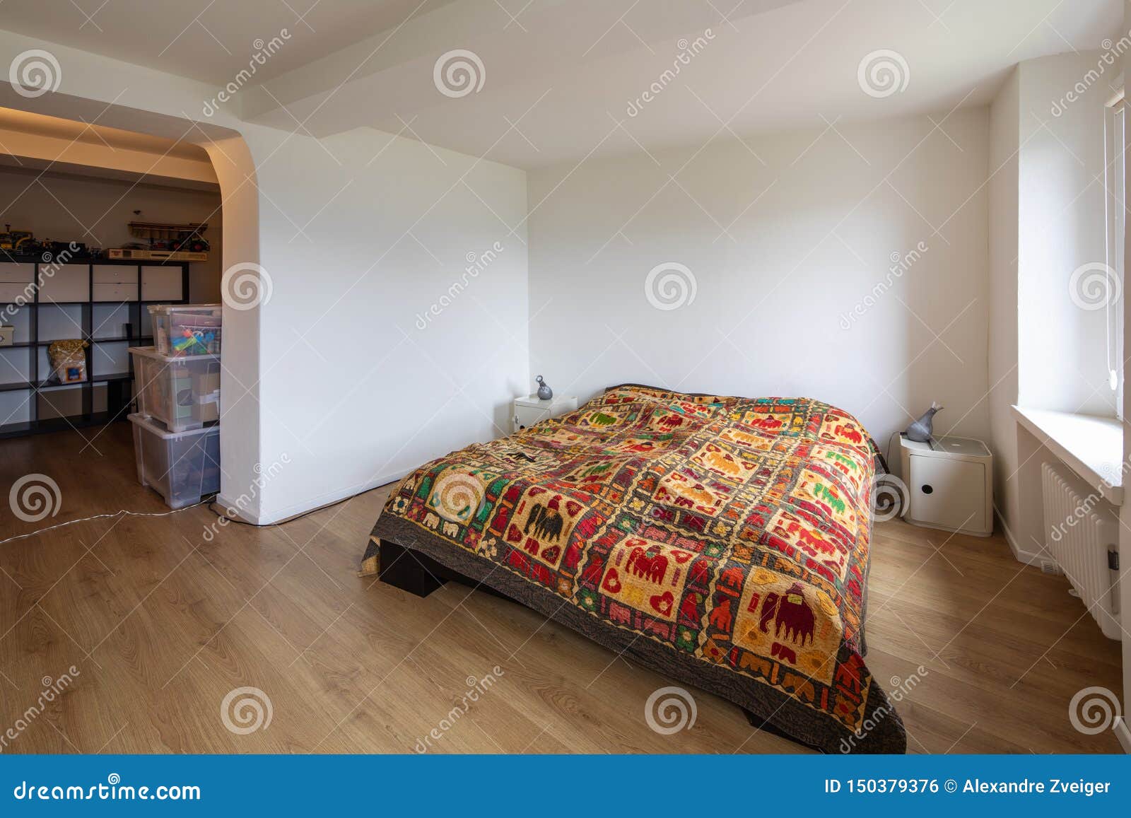 White Bedroom With Bed Covered With A Very Extravagant Blanket