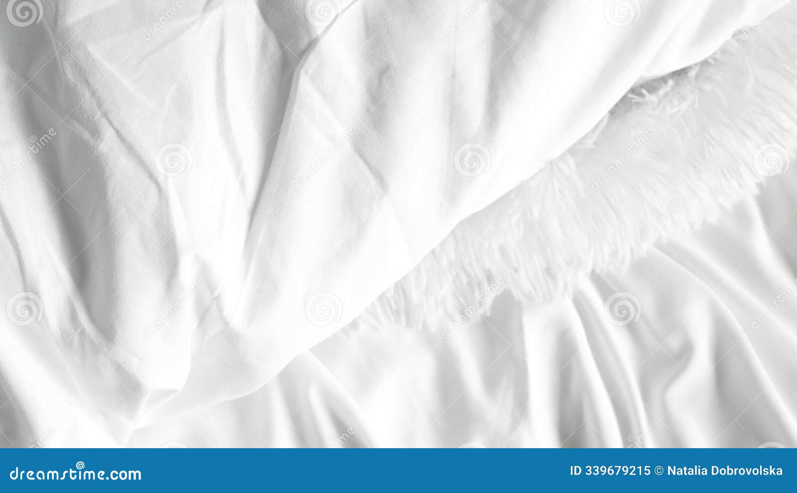 white bedsheets and soft blanket on plain background, minimalistic bedroom style