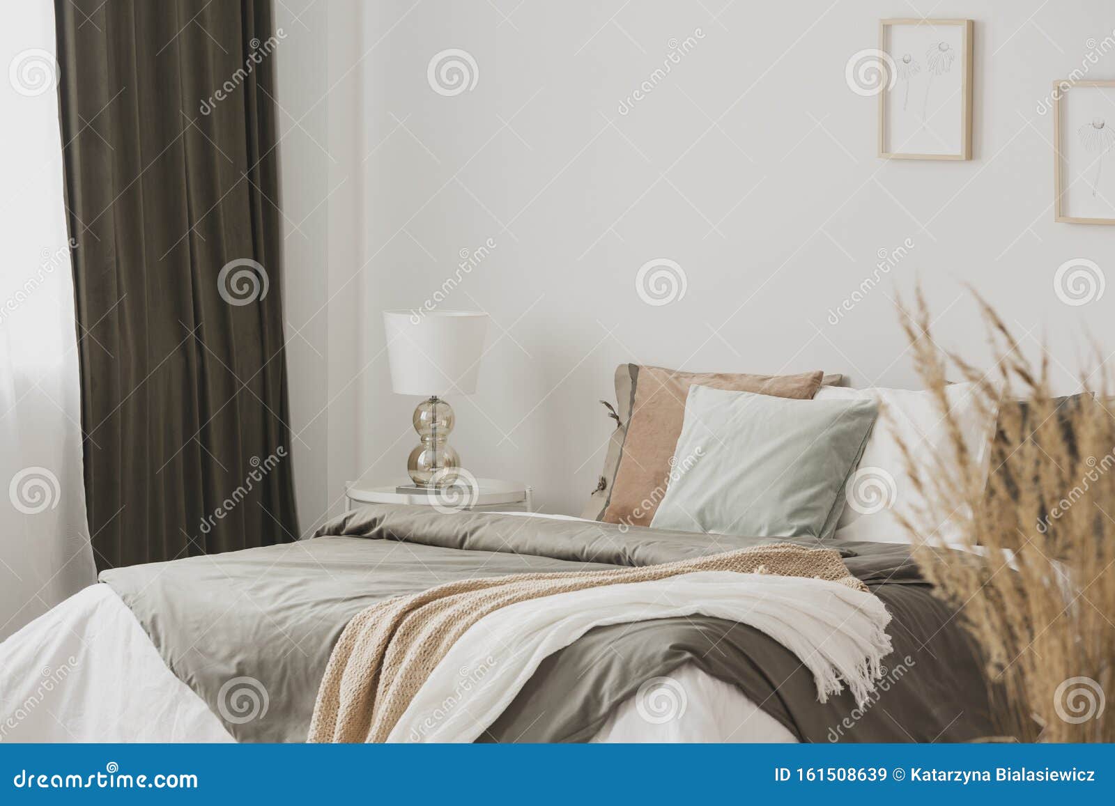 White and Beige Blankets on Grey Duvet on Comfortable Bed in Bright