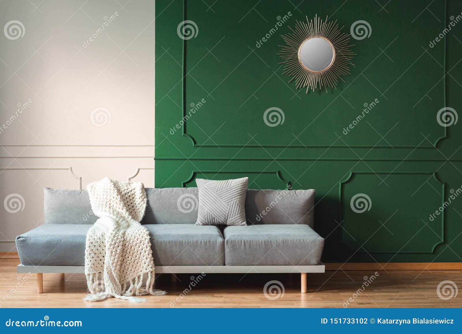 White Blanket and Grey Pillow on Long Comfortable Couch in Bright