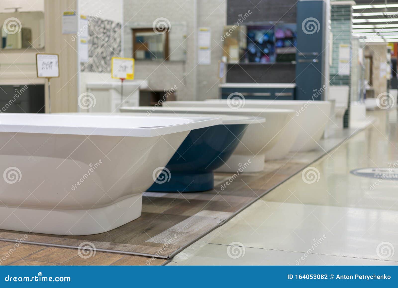 White and Blue Bathtubs in a Hardware Store. the Concept of Choosing