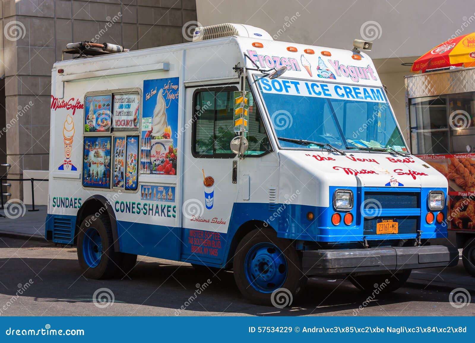 White And Blue Ice Cream Van On A 