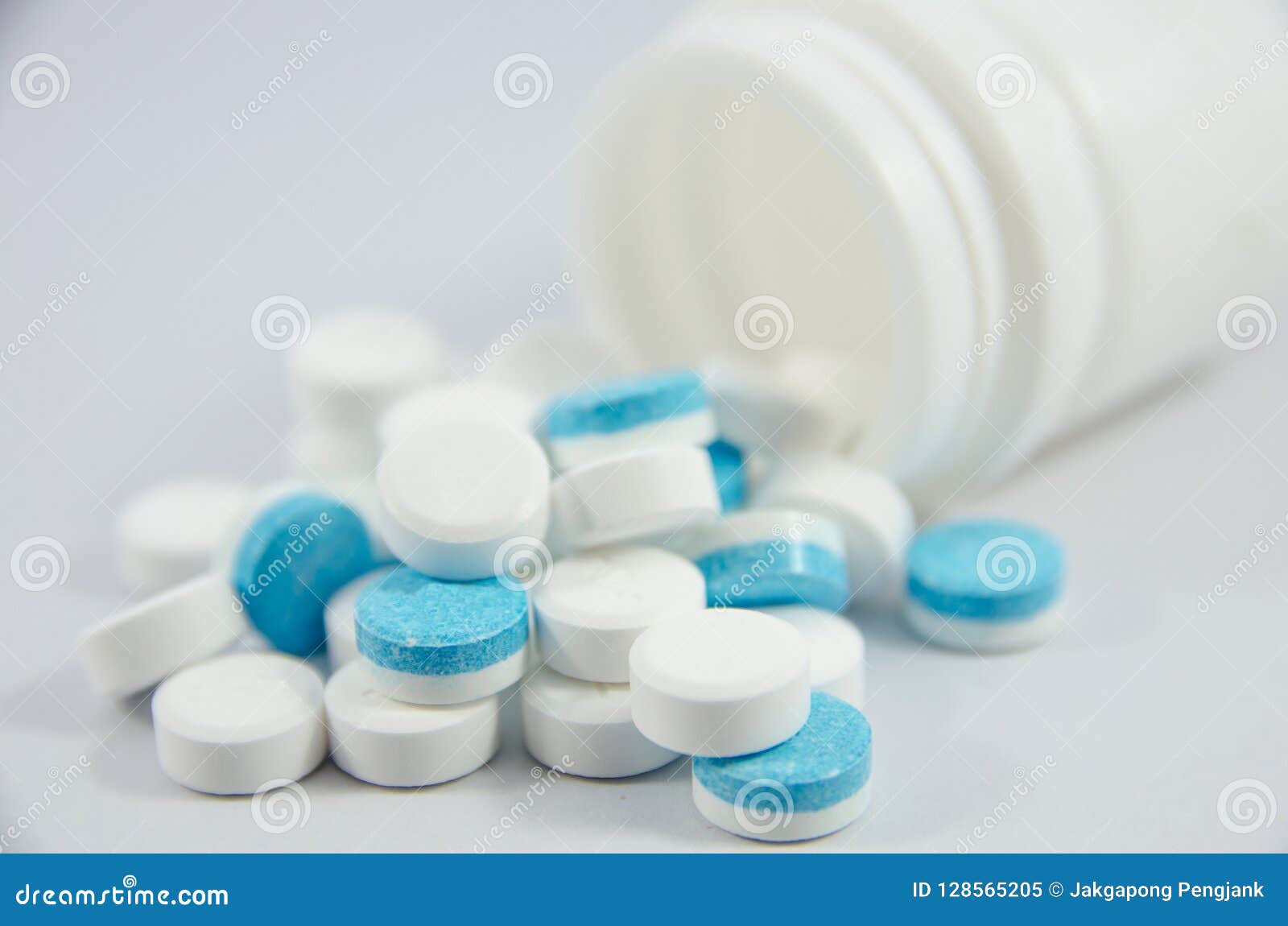 White and blue pill stock image. Image of detail, care 128565205