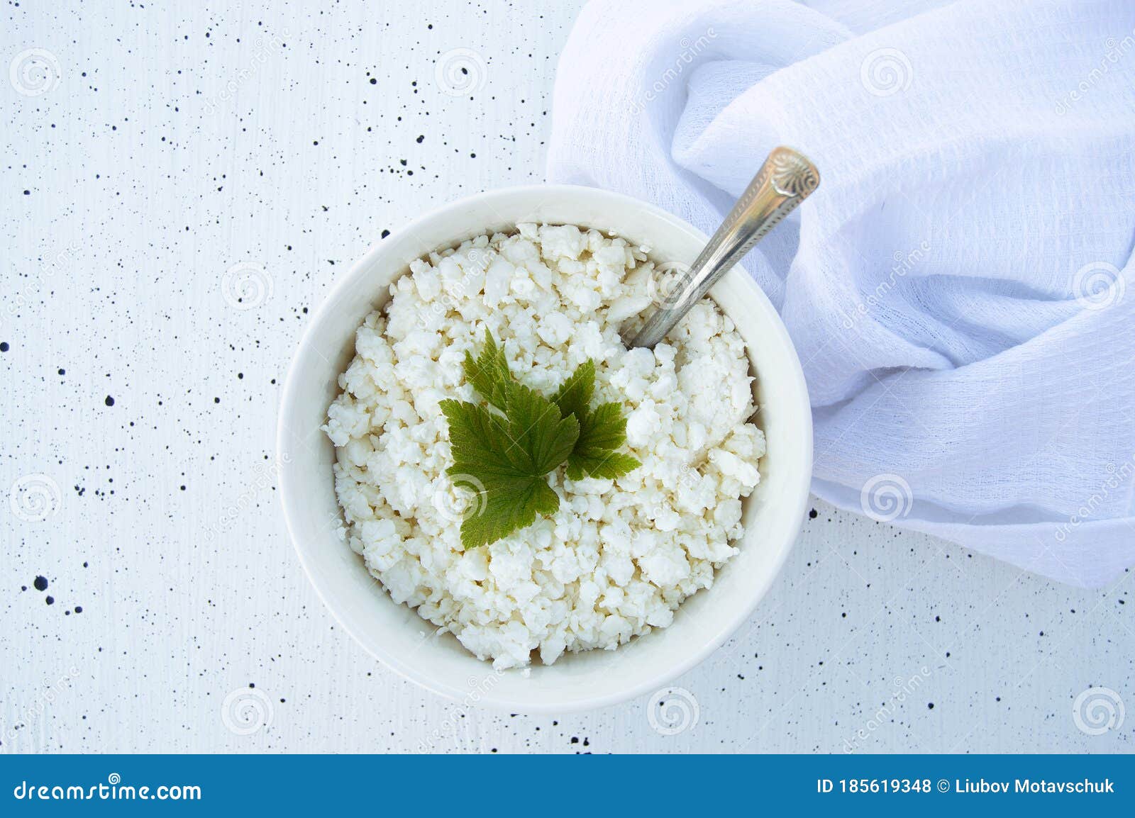White Bowl with Fresh Homemade Cottage Cheese with a Sheet of