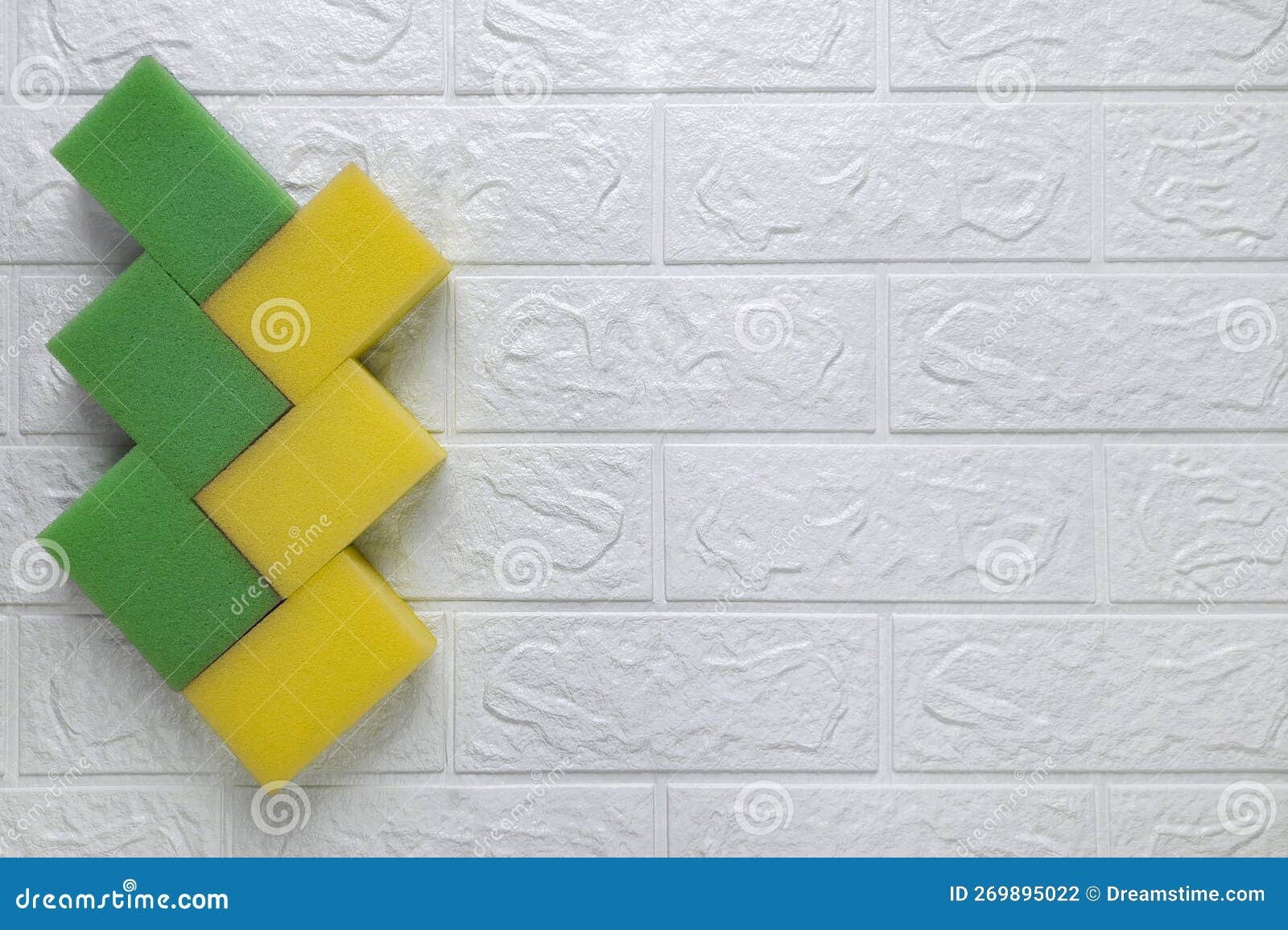 On White Brick Wall on Left are Kitchen Sponges for Washing Dishes, on