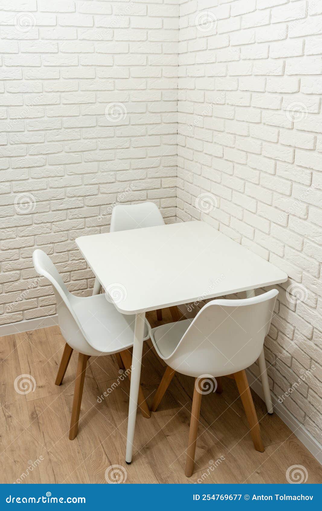 White Brick Wall with Table in Corner of Kitchen Stock Image Image of