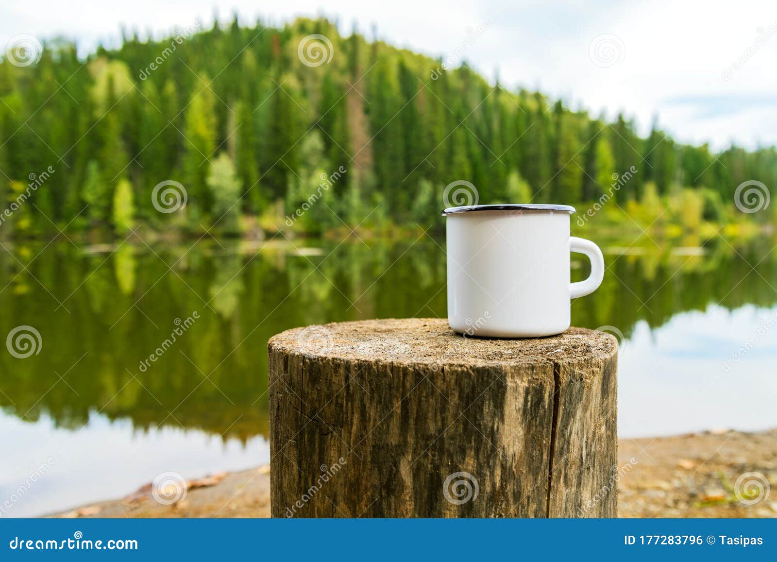 white campfire mug mockup with river bank view
