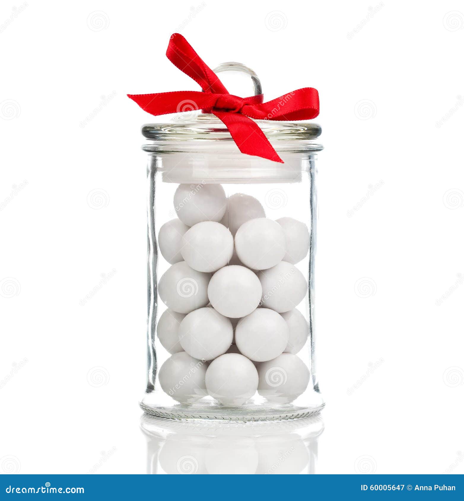 white candies, gumballs in glass jar