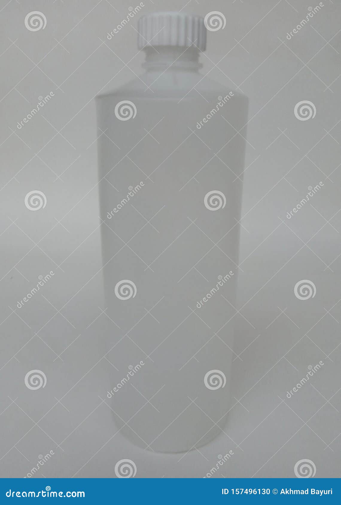 A White Canister Bottle with a Threaded Texture Lid Stock Photo Image