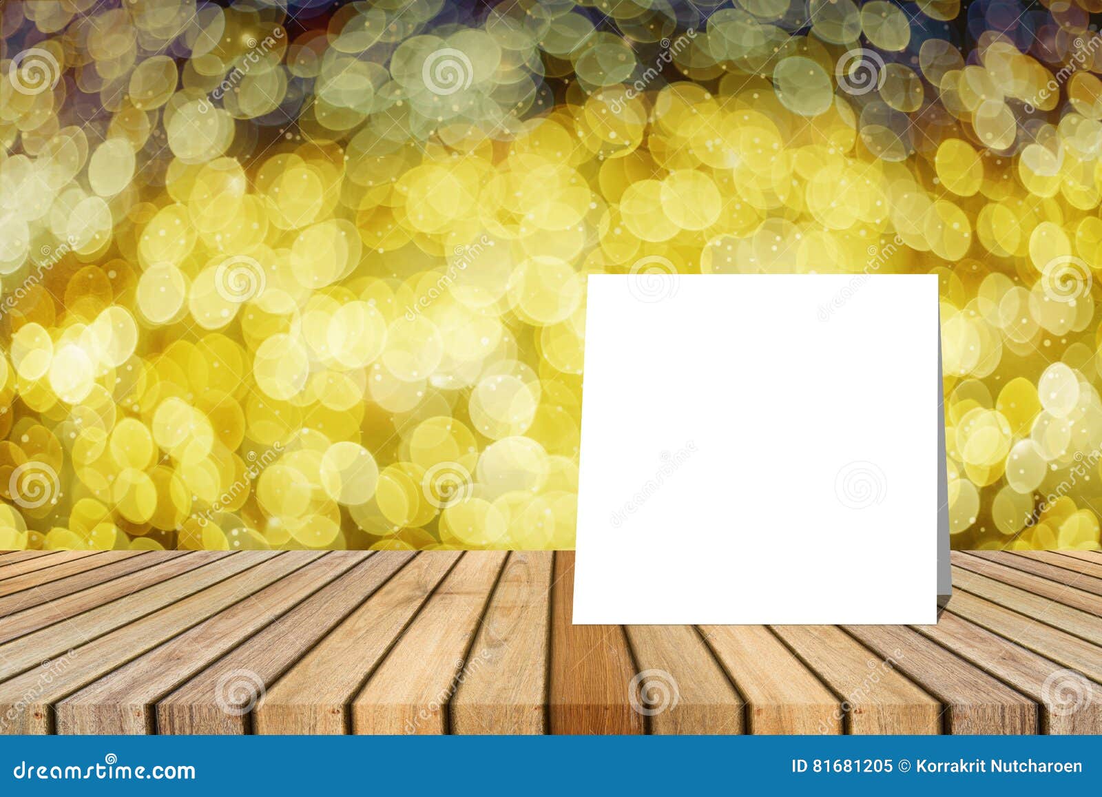 white card put on table and blurred bokeh out of focus in christmas night light background. product display template.