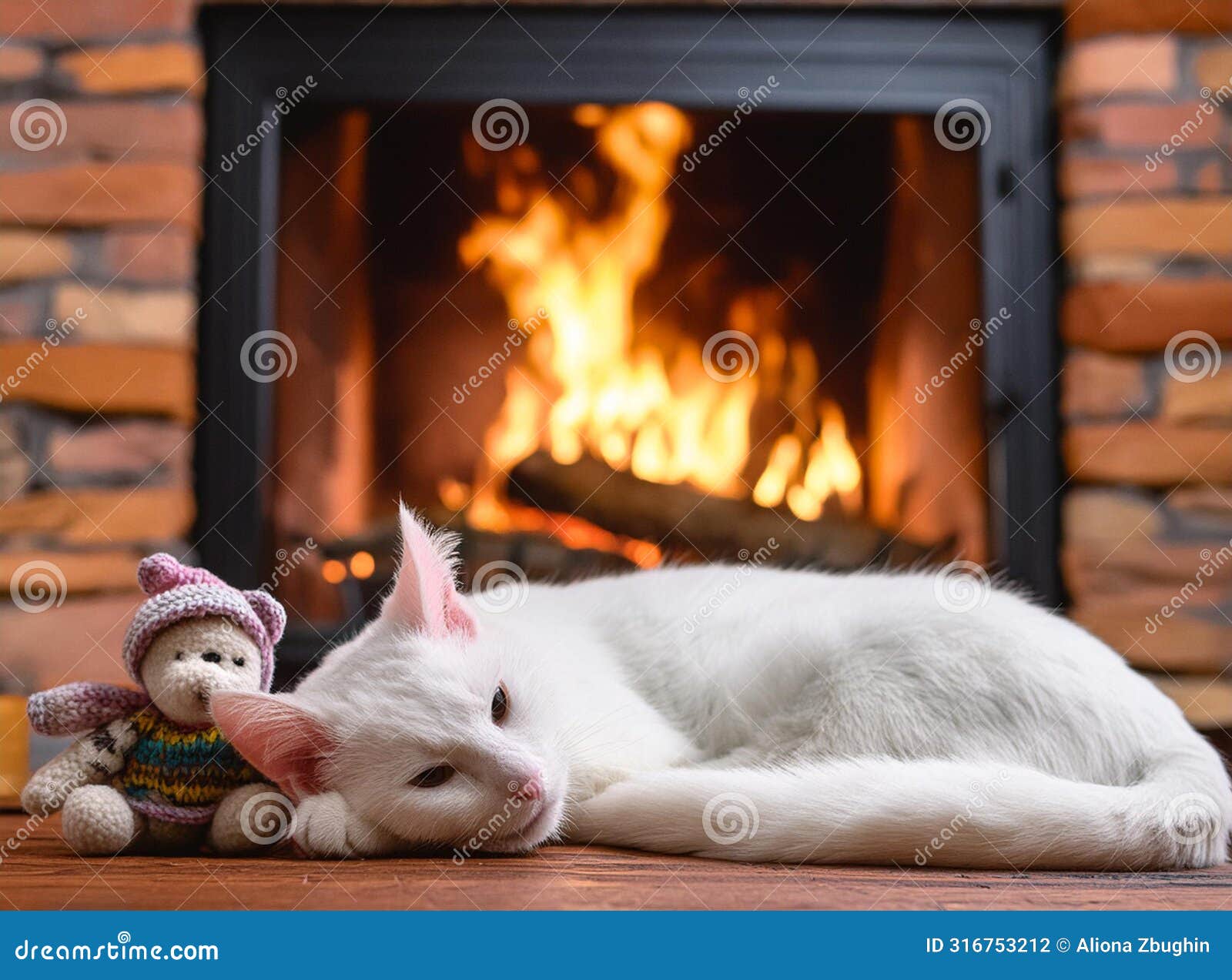 a white cat sleeping comfortably in front of the fireplace